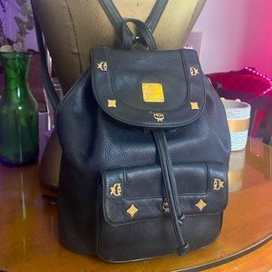 MCM vintage back pack with pull tie snap enclosure and side zipper